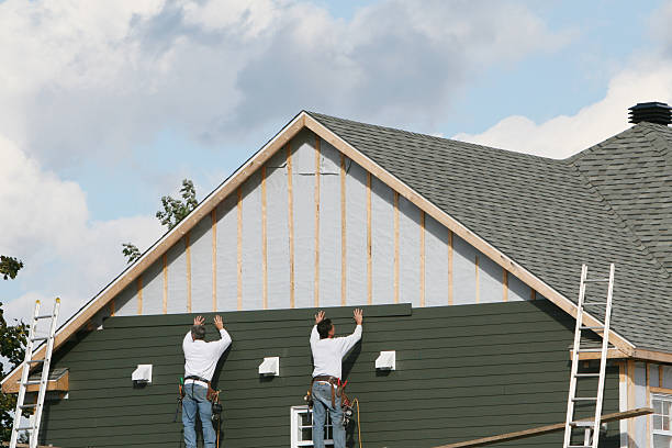 Professional Storm Damage Siding Repair technician working in Ashland, MA